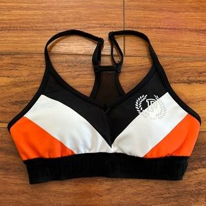 Sports bra in orange white and black by PINK